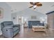 Bright and airy living room features vaulted ceilings, wood flooring and comfortable seating arrangement at 252 Heath Dr., Longs, SC 29568