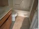 Bathroom featuring a tiled floor and wooden cabinets at 2862 Loblolly Ave., Little River, SC 29566