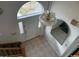 View of foyer with chandelier, tiled floors, large window and arched transom letting in bright natural light at 2862 Loblolly Ave., Little River, SC 29566