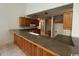 View of the kitchen with oak cabinets and a bar at 2862 Loblolly Ave., Little River, SC 29566