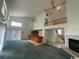 View of living room showing stairs, fireplace, bar, and large windows at 2862 Loblolly Ave., Little River, SC 29566