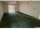 Spacious living room with sliding glass doors and a ceiling fan at 2862 Loblolly Ave., Little River, SC 29566