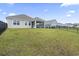 Well-maintained backyard with a covered patio, a privacy fence, and lush green lawn at 3078 Gillham Loop, Myrtle Beach, SC 29588