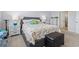 Comfortable bedroom featuring soft carpet, large bed with quilt, and natural light at 3078 Gillham Loop, Myrtle Beach, SC 29588