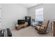 Simple bedroom with a window, carpet, a television, and a rocking chair at 3078 Gillham Loop, Myrtle Beach, SC 29588