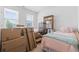 Bright bedroom features two beds, natural light, and functional storage solutions for an organized space at 3078 Gillham Loop, Myrtle Beach, SC 29588