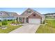 Charming home with brick facade, well-manicured landscaping, and a two-car garage at 3078 Gillham Loop, Myrtle Beach, SC 29588