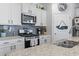 Modern kitchen showcasing stainless steel appliances, granite countertops, and ample white cabinetry at 3078 Gillham Loop, Myrtle Beach, SC 29588