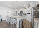 Well-lit kitchen with an island, stainless appliances, white cabinetry, and open floor plan at 3078 Gillham Loop, Myrtle Beach, SC 29588