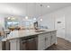 Spacious kitchen island with granite countertops, stainless steel appliances, and hardwood floors at 3078 Gillham Loop, Myrtle Beach, SC 29588
