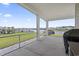 Covered patio offers serene lake views, creating an ideal outdoor living space for relaxing and entertaining at 3078 Gillham Loop, Myrtle Beach, SC 29588