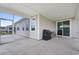 Spacious covered patio with BBQ grill for outdoor cooking, leading to a screened porch at 3078 Gillham Loop, Myrtle Beach, SC 29588