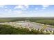 Aerial view of the neighborhood homes surrounding the lake and forest at 3573 Bells Lake Circle, Longs, SC 29568