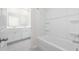 An all-white bathroom includes a tub and shower combo at 3573 Bells Lake Circle, Longs, SC 29568