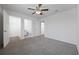 Comfortable carpeted bedroom with an open closet, white walls, and multiple doorways at 3573 Bells Lake Circle, Longs, SC 29568