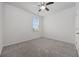 Bright bedroom with a ceiling fan, a window with blinds, neutral paint, and plush carpeting at 3573 Bells Lake Circle, Longs, SC 29568