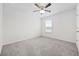 This bedroom offers a ceiling fan and a window that overlooks a community pond at 3573 Bells Lake Circle, Longs, SC 29568