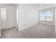 Bedroom featuring plush carpeting, neutral walls, and a window that provides ample natural light at 3573 Bells Lake Circle, Longs, SC 29568