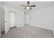 This bedroom offers a ceiling fan, a closet, and neutral paint and carpet at 3573 Bells Lake Circle, Longs, SC 29568