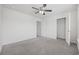This bedroom features a ceiling fan, a closet, and access to other rooms at 3573 Bells Lake Circle, Longs, SC 29568
