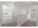 Hallway showcasing access to multiple rooms with carpet and white walls at 3573 Bells Lake Circle, Longs, SC 29568