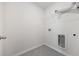 An empty laundry room, complete with tile flooring, base boards, and hookups at 3573 Bells Lake Circle, Longs, SC 29568