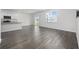 Spacious living room with durable flooring, natural light, flows into eat-in kitchen with island at 3573 Bells Lake Circle, Longs, SC 29568