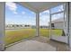 The screened porch with views of the pond and well-manicured lawn at 3573 Bells Lake Circle, Longs, SC 29568