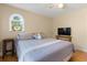 Comfortable bedroom featuring a ceiling fan, arched window, and television at 3721 Ed Smith Ave., Myrtle Beach, SC 29588