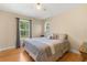 Cozy bedroom with a comfortable bed, a ceiling fan, and a window with natural light at 3721 Ed Smith Ave., Myrtle Beach, SC 29588