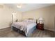 Spacious bedroom with a ceiling fan, neutral walls, and a large bed, creating a relaxing atmosphere at 3721 Ed Smith Ave., Myrtle Beach, SC 29588