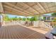 Expansive covered deck with outdoor seating, white railings, and views of the lush greenery at 3721 Ed Smith Ave., Myrtle Beach, SC 29588