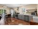 Modern kitchen with stainless steel appliances, gray cabinetry, and tiled floors at 3721 Ed Smith Ave., Myrtle Beach, SC 29588