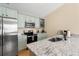 Well-lit kitchen with stainless steel appliances, granite countertops, and modern appliances at 3721 Ed Smith Ave., Myrtle Beach, SC 29588