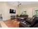 Inviting living room with comfortable leather seating and a mounted television at 3721 Ed Smith Ave., Myrtle Beach, SC 29588