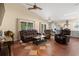 Spacious living room featuring leather furniture, tile floors, and plenty of natural light at 3721 Ed Smith Ave., Myrtle Beach, SC 29588