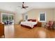 Spacious main bedroom with hardwood floors, vaulted ceiling, and access to a private balcony at 3721 Ed Smith Ave., Myrtle Beach, SC 29588