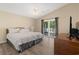 Bright main bedroom with a ceiling fan, sliding glass doors to a private deck, and a large window at 3721 Ed Smith Ave., Myrtle Beach, SC 29588
