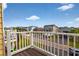 Balcony view shows homes in this coastal neighborhood, plus mature trees at 39 Newport St., Ocean Isle Beach, NC 28469