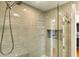Elegant walk-in shower features gray tile and glass door at 39 Newport St., Ocean Isle Beach, NC 28469