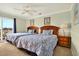 Inviting bedroom with two beds, a ceiling fan, and access to a private balcony at 39 Newport St., Ocean Isle Beach, NC 28469
