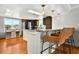 Open kitchen features a breakfast bar with seating and natural light to enjoy meals at 39 Newport St., Ocean Isle Beach, NC 28469