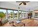 Living room with large windows showing waterfront neighborhood views at 39 Newport St., Ocean Isle Beach, NC 28469