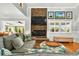 Comfortable living room featuring a stone fireplace, bright window views, and plush seating at 39 Newport St., Ocean Isle Beach, NC 28469