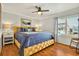 Bedroom features a ceiling fan, shutters, and a decorative bed frame at 39 Newport St., Ocean Isle Beach, NC 28469