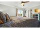 Bedroom features ceiling fan, shutters, and patterned bedspread at 39 Newport St., Ocean Isle Beach, NC 28469