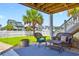 This outdoor patio offers comfortable seating and a peaceful setting, enhancing the charm of the waterfront home at 39 Newport St., Ocean Isle Beach, NC 28469