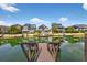 Waterfront homes with docks line the canal, creating a picturesque neighborhood scene under a bright, partly cloudy sky at 39 Newport St., Ocean Isle Beach, NC 28469