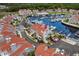 Aerial view of condos overlooking a marina filled with boats and lush, tropical landscaping at 4396 Baldwin Ave. # 30, Little River, SC 29566