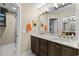 Elegant bathroom features a double vanity with marble countertop and modern fixtures, and a glass shower at 4396 Baldwin Ave. # 30, Little River, SC 29566